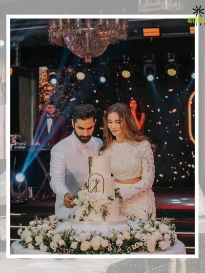 A picture-perfect cake-cutting moment at a glamorous reception. We coordinate with all vendors to ensure every key moment is beautifully staged, with dramatic lighting and confetti.