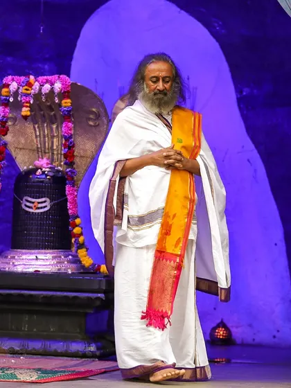 I am standing in front of the Shiva Lingam at our ashram temple during a Rudra Puja. This powerful ceremony is a cornerstone of our weekly offerings, open for all to attend.