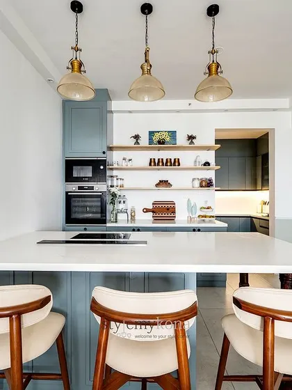 A closer look at the kitchen island with its integrated cooktop and seating, making it a social hub for the family.