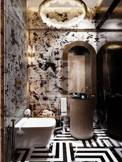 Bold and artistic, this powder room features striking black-and-white patterned marble and geometric floor tiles. The unique light fixture and fluted pedestal sink make it a memorable design statement.
