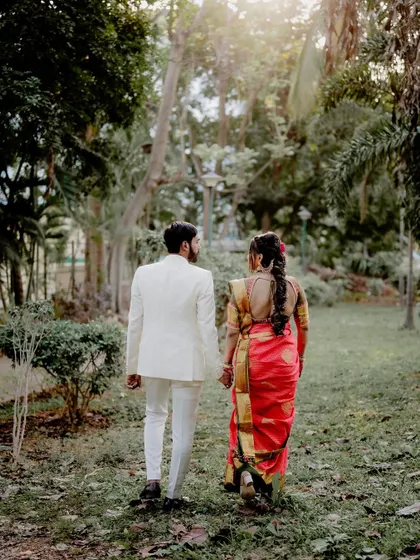 A shot from behind as the couple walks together. This tells a story of a shared journey beginning, with the focus on their coordinated steps and the beautiful scenery ahead.