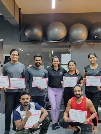 A proud group of students holding their certificates after completing our Mobility and Recovery Exercise workshop.