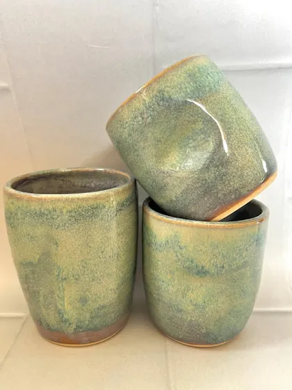 A set of three turquoise grip mugs, perfect for sharing a drink with friends.