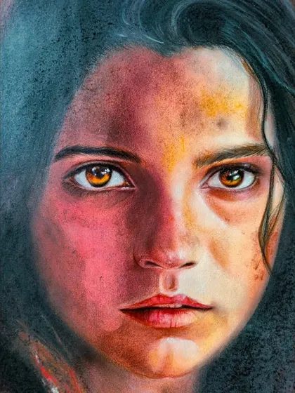 A close-up of the soft pastel portrait, showing the texture and blending of colors used to create a realistic effect.