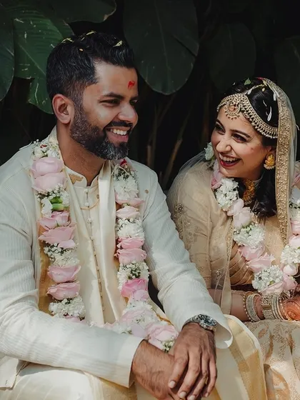 A candid moment of laughter and conversation between the couple during their wedding ceremony.