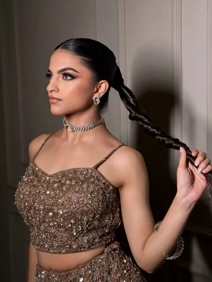 A classic smokey eye for a glamorous evening look. The deep, sultry tones on the eyes are balanced with a soft, neutral lip color.