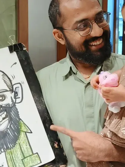 A father and his little one admiring the caricature. It's a special moment when families get to see their fun portraits together.