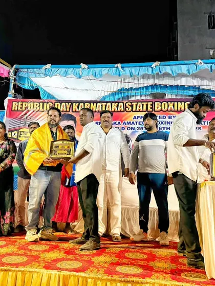 On stage being felicitated during the Republic Day Karnataka State Boxing Championship event. My involvement in the state's boxing community is something I value deeply.