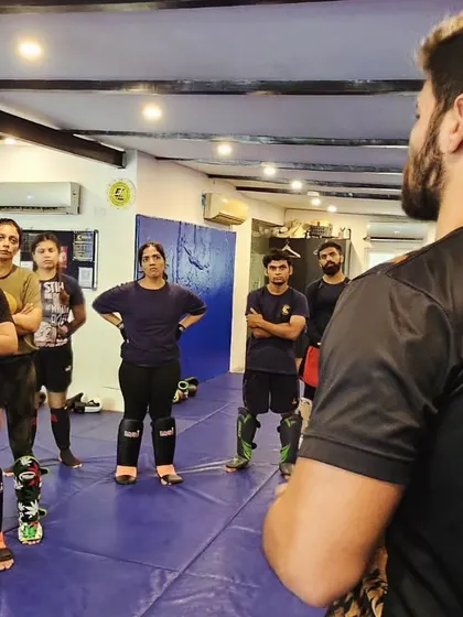 A view from behind the coach, showing an attentive group of students ready to learn. We welcome all levels, and our female students are a strong part of our striking crew.