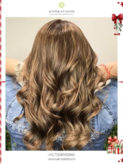 A gorgeous blend of brown highlights with blonde and brunette tones, styled into festive curls for the perfect holiday look.