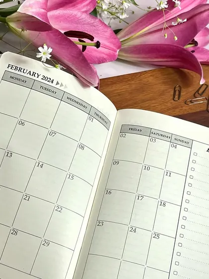 A look inside the monthly spread of our 2024 planner. The layout is clean and spacious, giving you a clear view of your commitments.
