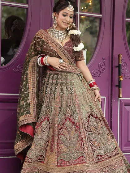 A full-length shot of the multi-tonal lehenga, showing its beautiful colors and heavy work.