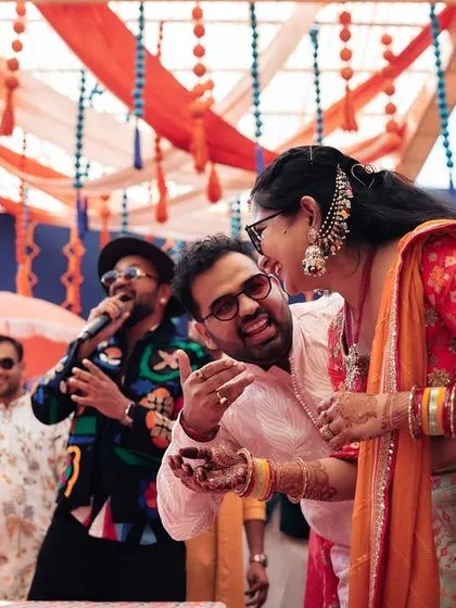 The best part of my job is seeing the genuine laughter and joy on people's faces. Here, I'm sharing a light-hearted moment with guests during a wedding game.