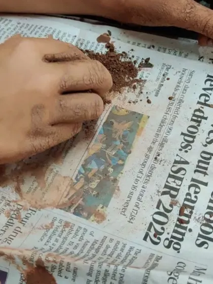 Sometimes the process is the entire point. Here, an eight year old's hands are simply exploring the texture of the clay, crumbling and feeling it. This sensory play is incredibly important for emotional processing and relaxation, even if it does not result in a finished piece.