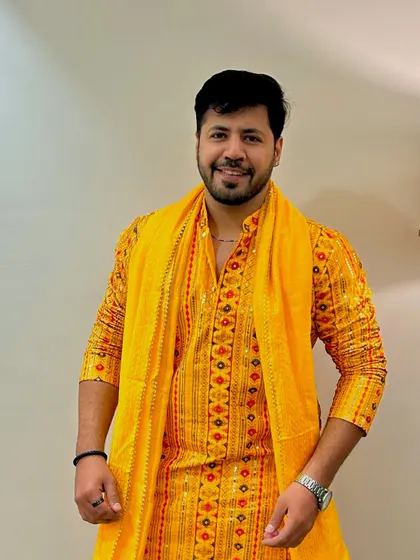 A full-length view of the yellow kurta, showing how the complete outfit comes together. Professional from head to toe.