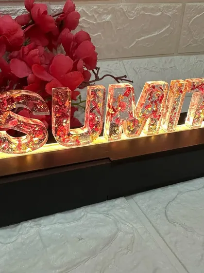 This piece combines personalization, flower preservation, and lighting to create a truly one-of-a-kind wedding or anniversary gift.