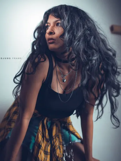 A dynamic pose showing off voluminous hair and layered styling. This image from the 'Raw Rebellion' series demonstrates how I use movement to create energy in a shot.