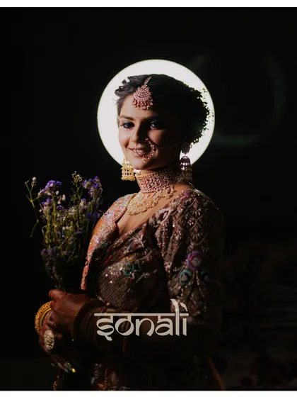 A creative and modern bridal portrait of Sonali in Pushkar. The ring light effect creates a halo, giving her an ethereal and stunning look.
