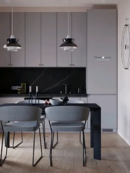 A minimalist dining and kitchen concept in shades of grey and black. The clean lines and simple forms are perfect for a modern, uncluttered home.