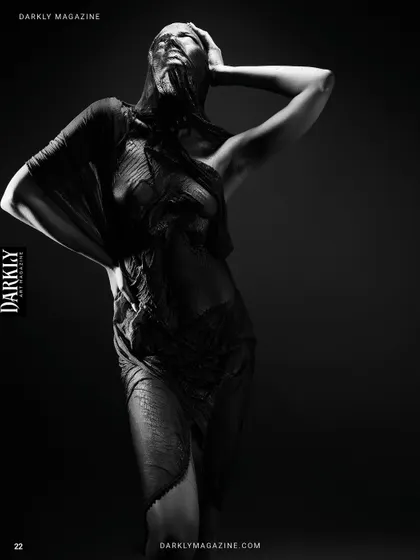 A full-body shot from the "Elegy in Motion" series, showcasing the draping of the fabric and the model's pose.