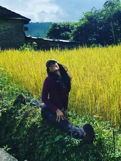 Taking a moment to relax and be present in the lush paddy fields of Nepal. Mindfulness is woven into every part of our retreat experience.