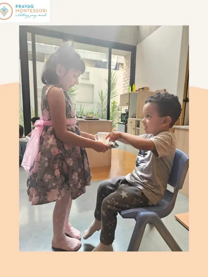 This interaction teaches children how to offer and receive things politely. These daily practices in grace and courtesy build a foundation of mutual respect.