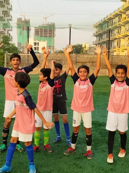 The joy of playing with friends. Our players celebrating on the field, full of energy and excitement. This is where lifelong friendships are made.