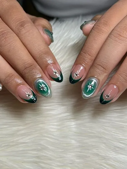 A celestial-inspired design in deep green and silver, with hand-painted starbursts and a sparkling outline.