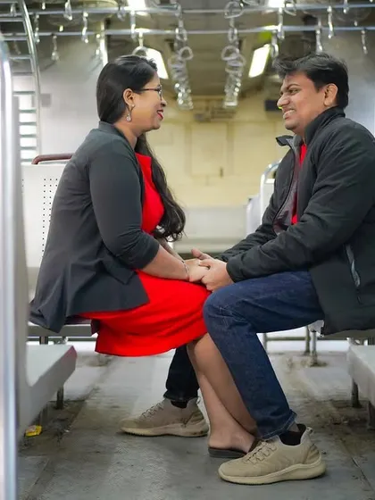 Finding romance in the everyday. This couple shares a laugh while seated in a Mumbai local train, a location that was part of their story. I focus on making you feel comfortable so your real personalities come through.