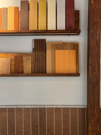 Inside the extension, we designed shelves to display our library of material samples. The space is used for meetings and brainstorming, with a large central table for our team to gather around.