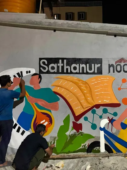 My team and I working late into the night to bring the Sathanur Nook mural to life. Community projects often require that extra dedication.