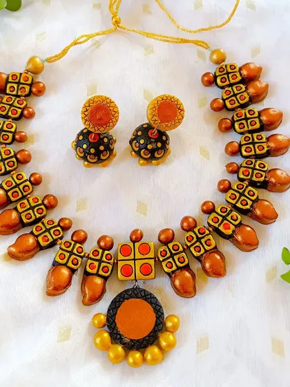 The same unique necklace design in a copper and black combination.