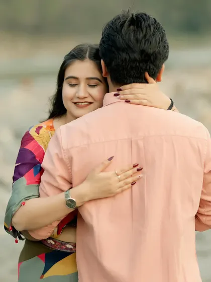 A close, intimate hug from behind, capturing the warmth and affection between the couple during their pre-wedding shoot. These are the simple, powerful moments I aim to preserve.