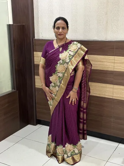 How lovely our client looks in this pure Mysore crepe saree with embroidery and cutwork. The deep purple color is so rich.