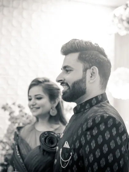 A classic black and white profile shot of the couple. This timeless image captures their happiness and the celebratory atmosphere of their engagement.