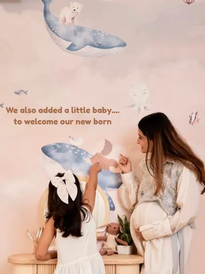 A special detail in the new wallpaper was adding a little baby beluga to welcome our newborn, a sweet way to include him in her space.