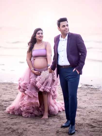 A candid walking shot on the beach. The movement in the dress and the natural stride give this maternity photo a relaxed and joyful feel.