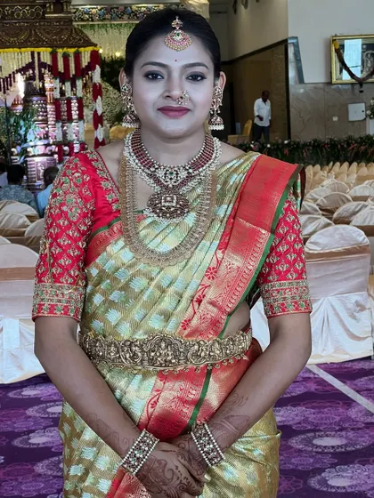 A full-length view of the bride, standing confidently in her complete Muhurtham attire, ready for her grand entrance.