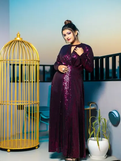 A confident pose that captures the essence of this glamorous fashion shoot, with the makeup designed to stand out.