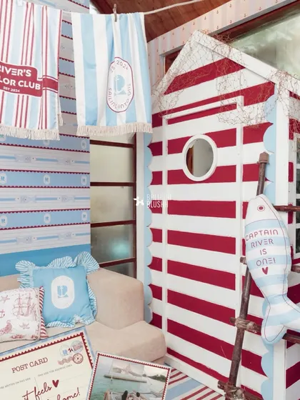 A wider view of the sailor cabin and custom-printed towels, showing how all the elements come together.