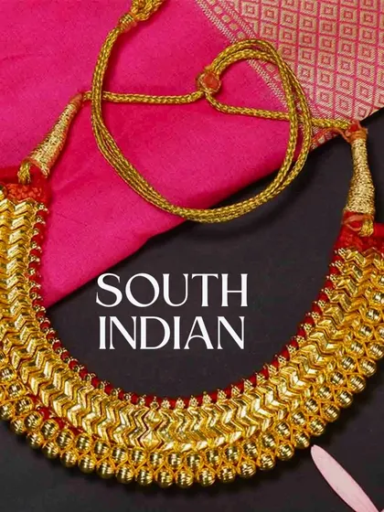 We also offer a beautiful collection of traditional South Indian jewellery. This classic gold-finish necklace is perfect for brides wanting an authentic temple jewellery look for their wedding ceremonies.