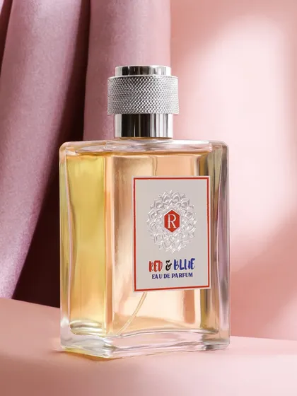 This image uses a rich, pink satin backdrop to give the perfume a romantic and feminine feel. The clean lighting focuses on the bottle's classic shape and silver cap, conveying simple elegance.