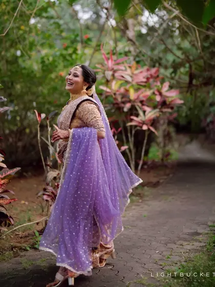 A joyful, candid shot of the bride during her wedding festivities.