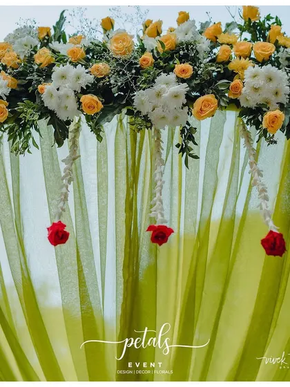 A simple and elegant wedding welcome board, with a beautiful floral arrangement on top. This design is timeless and sophisticated.
