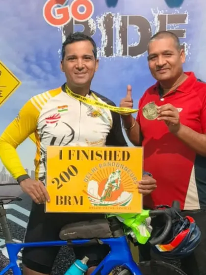 Two riders with their medals after finishing a 200 BRM. The journey to becoming a Super Randonneur starts here.
