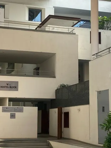 The entrance to a hostel block at Vellore International School. The design uses varying levels and open passages to create a porous and interactive environment for students.
