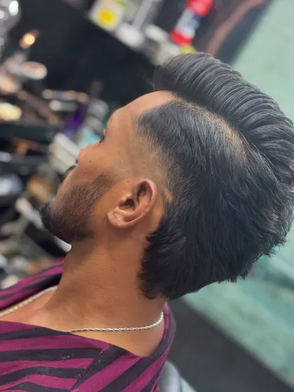 A top-down view of a pompadour-mullet, showing the volume and length.