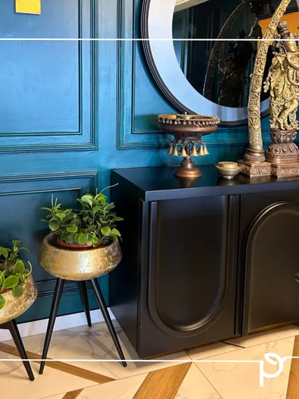 A closer look at the bespoke brass planters with stands, holding Peperomia plants. This setup demonstrates our attention to detail in matching planters and plants to the client's specific interior style.