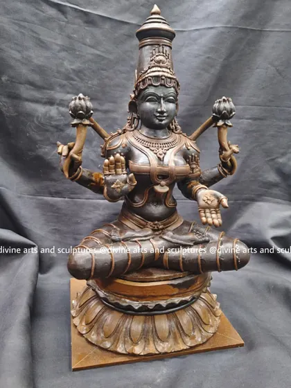Another shot of the Mahalakshmi wax model, emphasizing the serene expression and the perfect symmetry we aim to achieve in our devotional sculptures.
