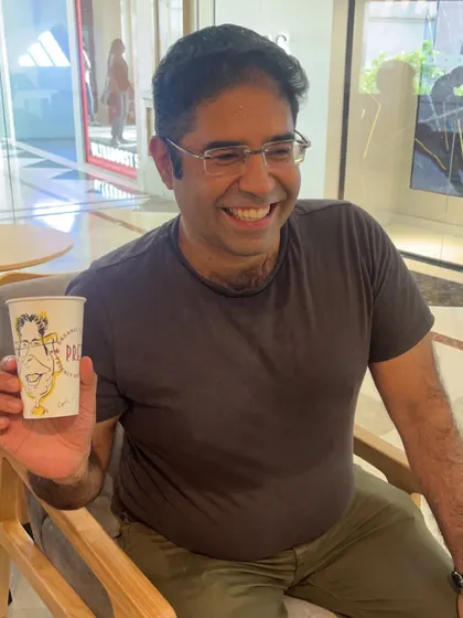 His laugh says it all. A happy customer enjoying the caricature experience at Pret.